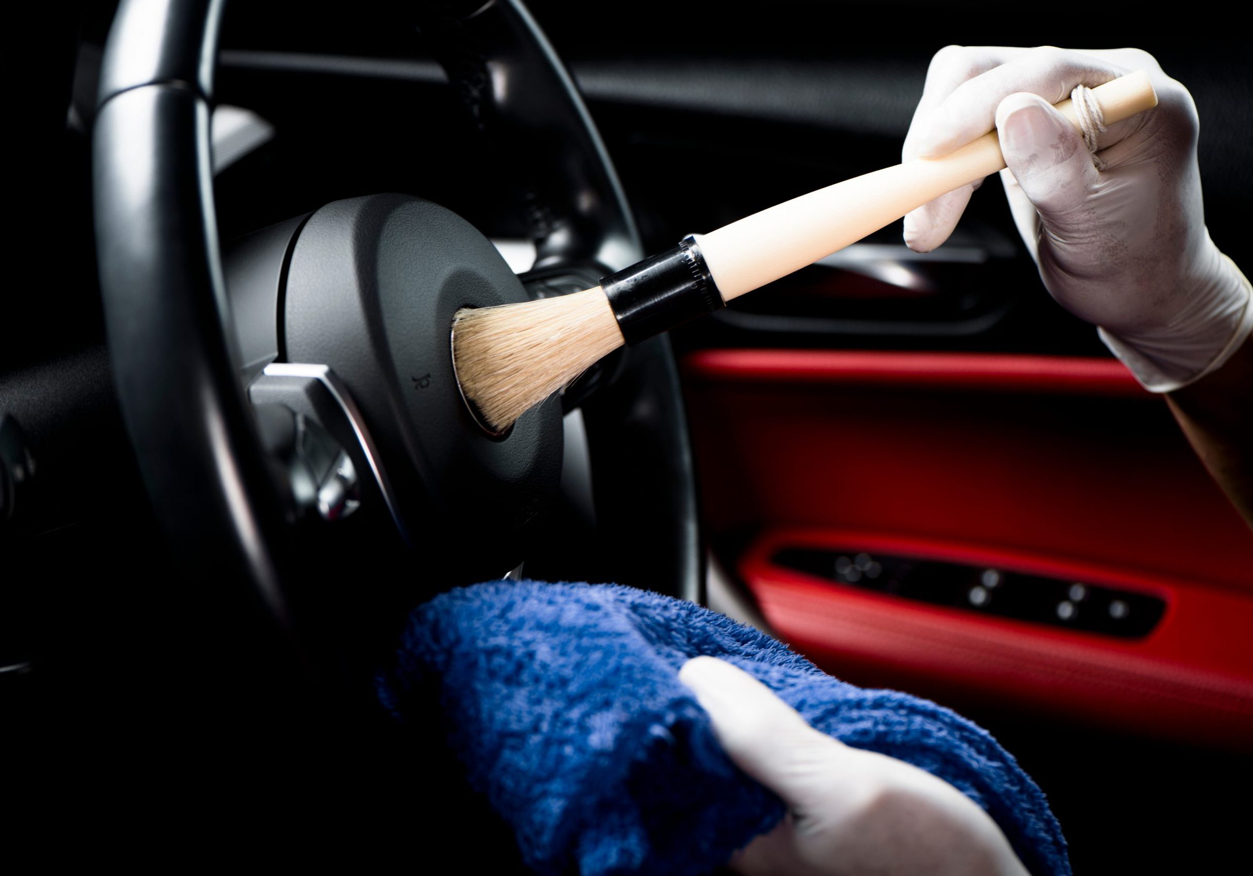 Car,Detailing,Series,,Man,Use,Brush,Cleaning,On,Hand,Wheel.