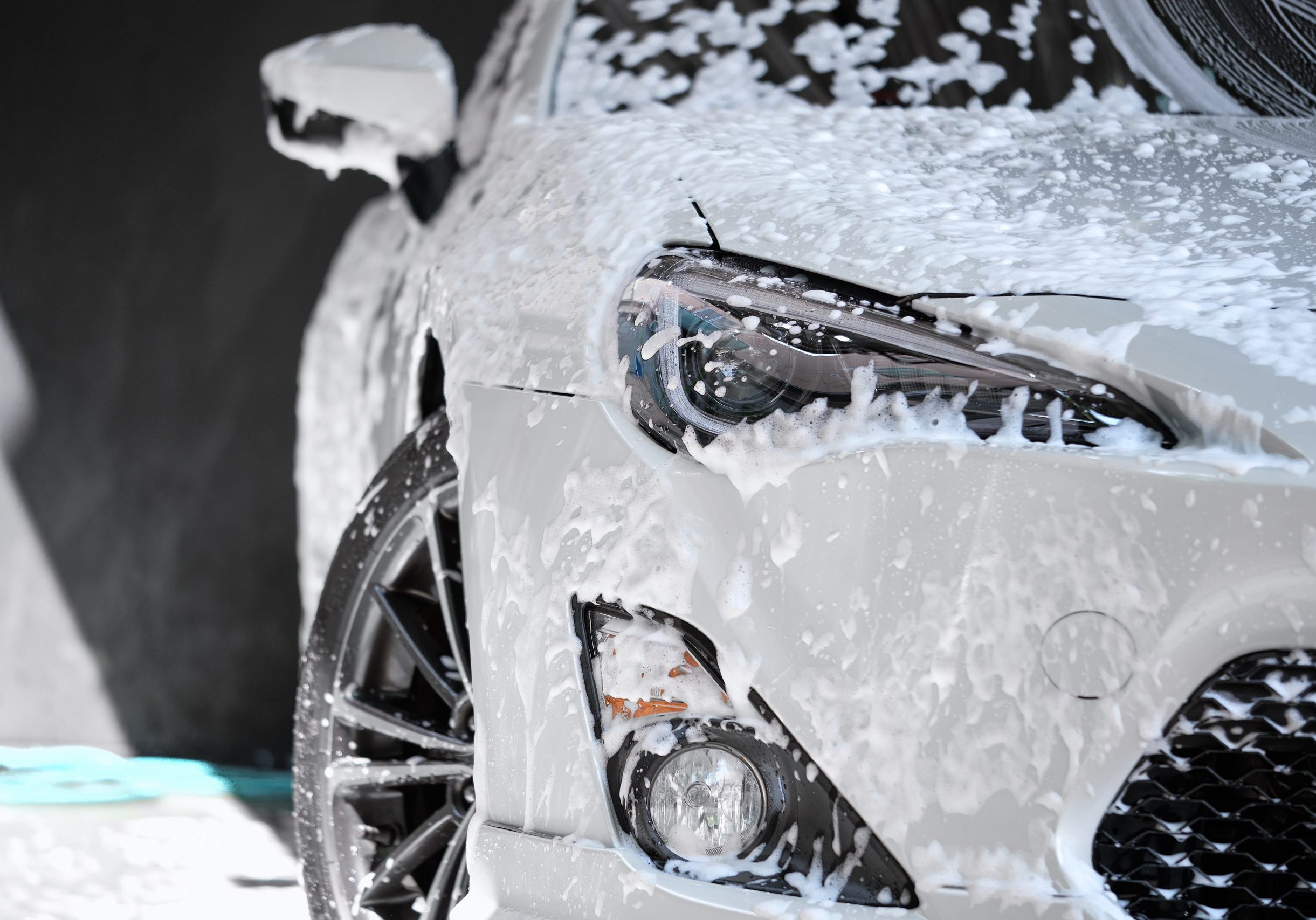 Car,Wash,Concept.,Front,View,Of,White,Sports,Car,Covered